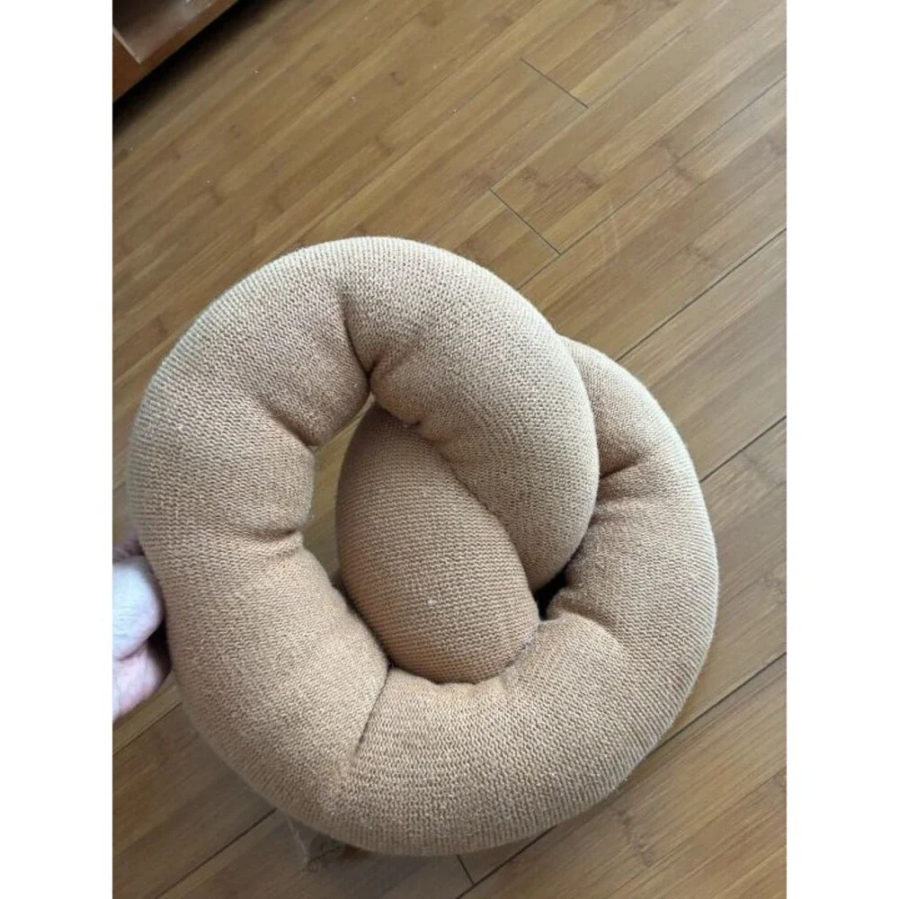 Large Estella hand-knitted organic cotton pretzel pillow